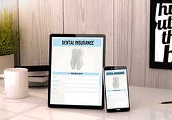 Dental insurance forms on tablet and phone