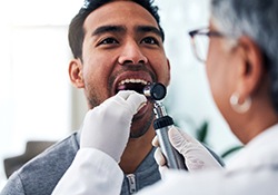 Male patient undergoing dental exam