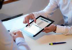 An insurance agent discussing dental insurance with a patient