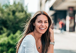 woman smiling while outside
