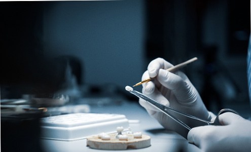 a technician working on dental crowns in Fort Mill