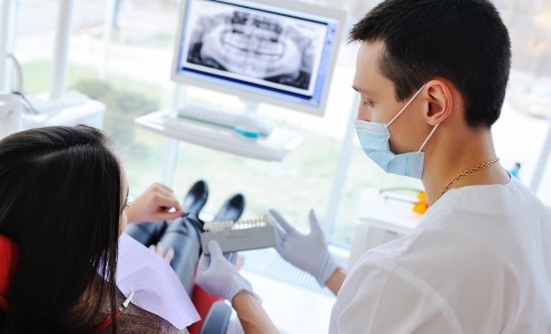 Dental patient at dentist for preventive dentistry to avoid dental emergencies