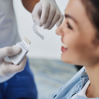 Dental patient smiling during consultation