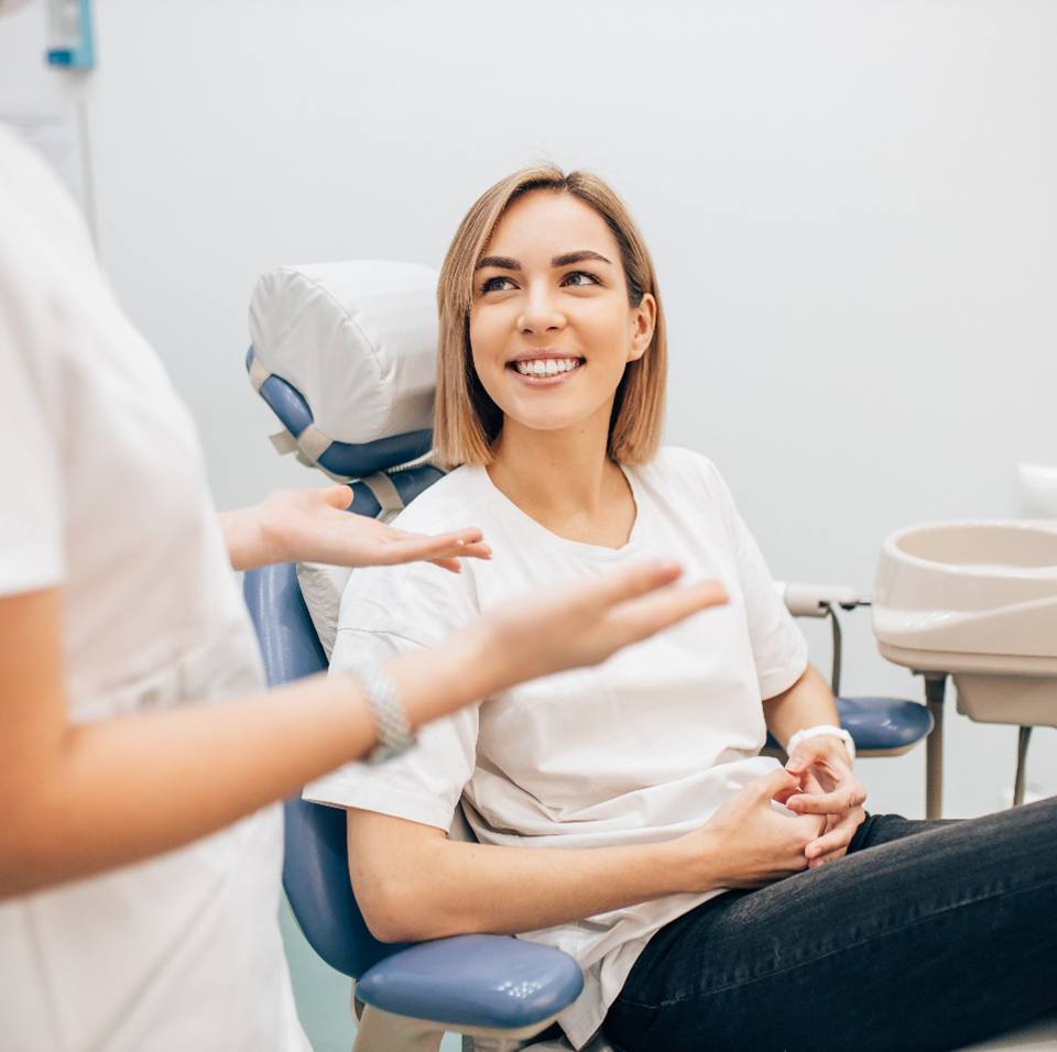 dentist talking to patient about insurance 