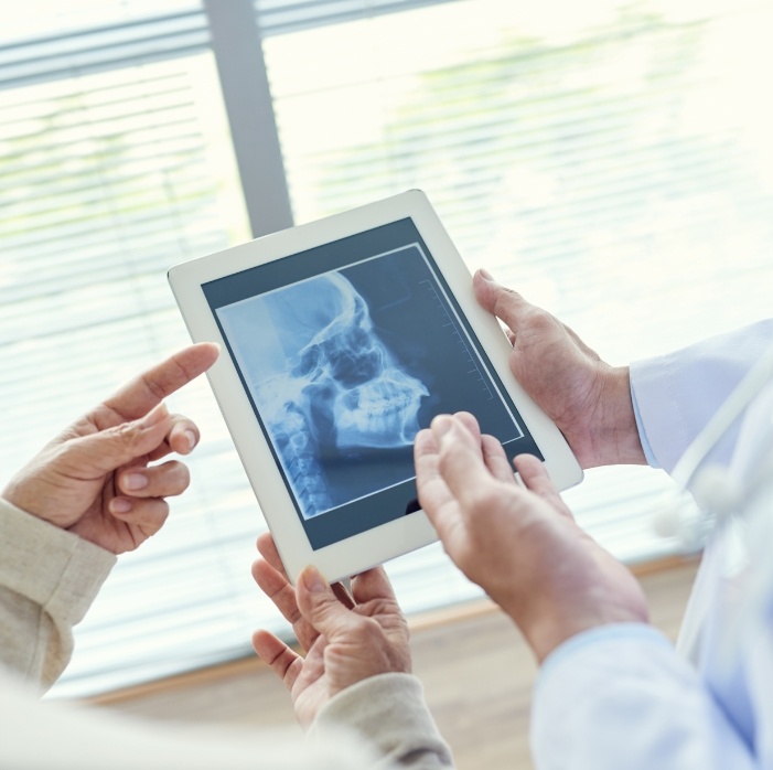 Dentists reviewing dental x-rays before preventive dentistry visit