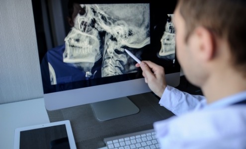 Dental team member reviewing digital x-rays