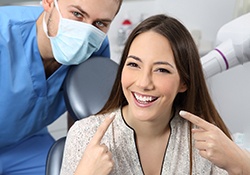 a patient smiling after getting her veneers