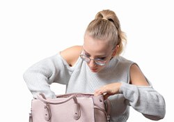 Woman searching her purse for lost Invisalign tray