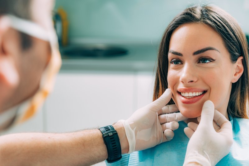 Dentist with beautiful female patient