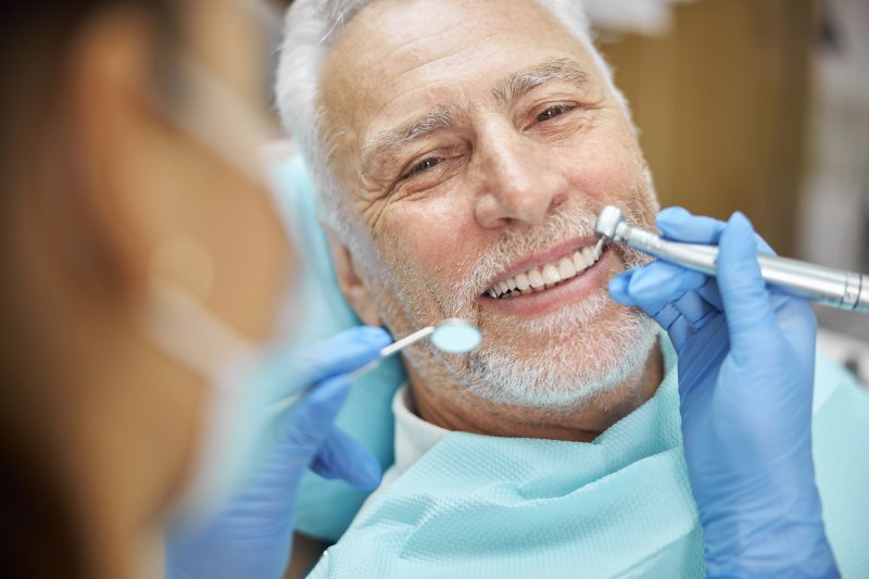 man smiling during dental checkup