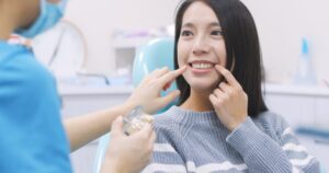 Patient asking her dentist if veneers are right for her