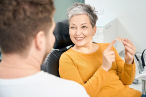 a patient with dentures smiling