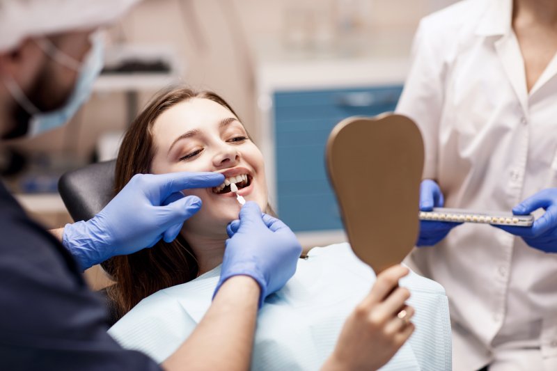A woman preparing to get cosmetic dentistry from her dentist